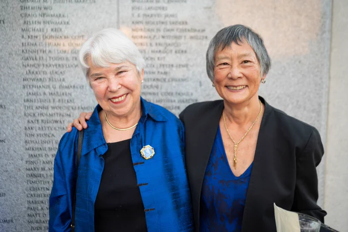 Chancellor Carol T. Christ and Nadine Tang M.S.W. ’75, both smiling, are pictured together.