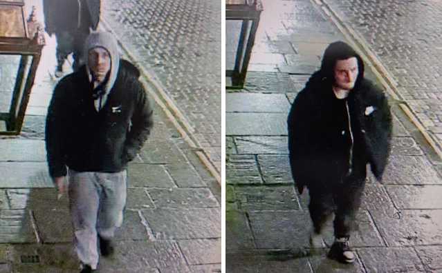 Two white men wearing grey/black tracksuits