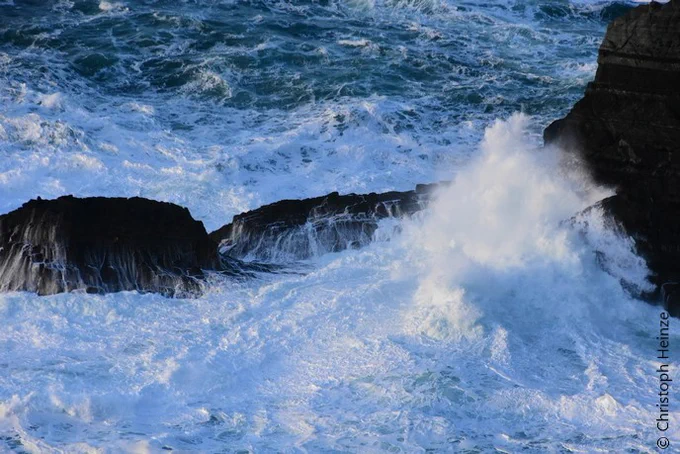 Waves crashing on rocks.