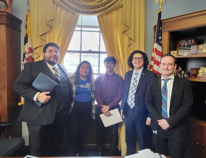 Five people posing for a group photo in a Congressional office, including Generation Hope's Student Advocacy Coordinator Yoslin Amaya Hernandez
