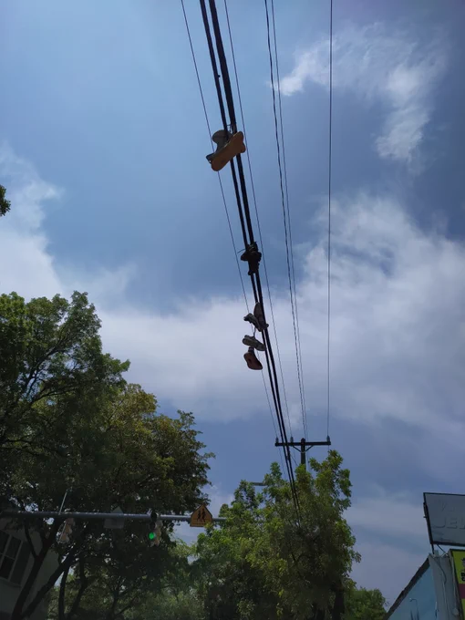 Hanging shoes photo by nycmoments.nyc