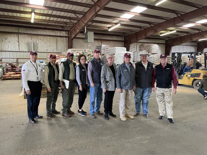 Chancellor Sharp stands with the directors of various System state agencies.