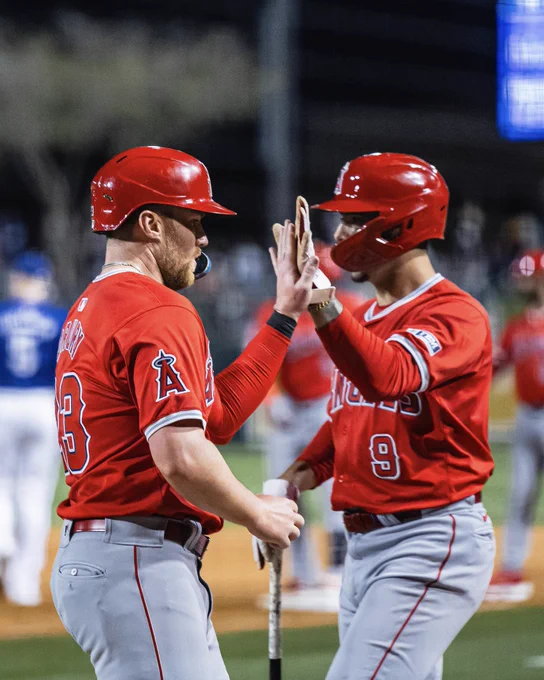 Drury and Neto high five one another during the Angels’ time to bat.