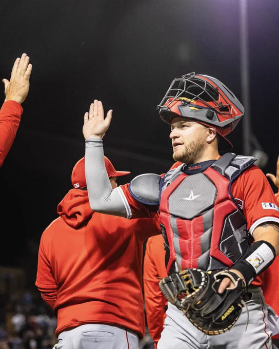 Caleb Hamilton high fives his teammates following the win.