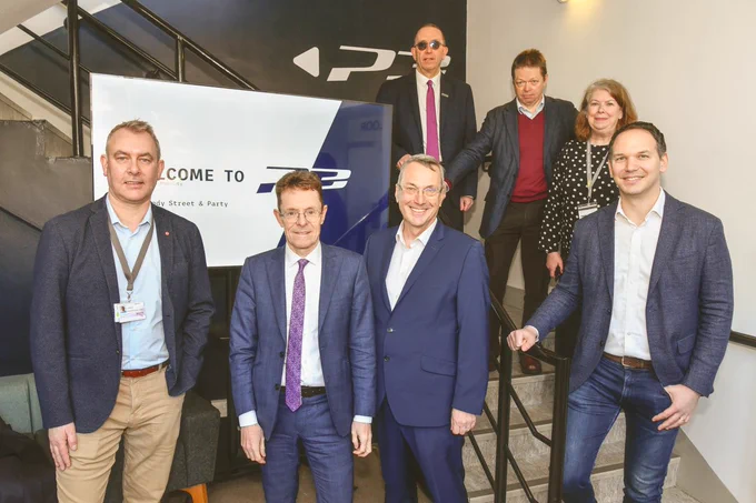 Andy Street with the VC, Prof Stuart Croft, and others posing for a photo.