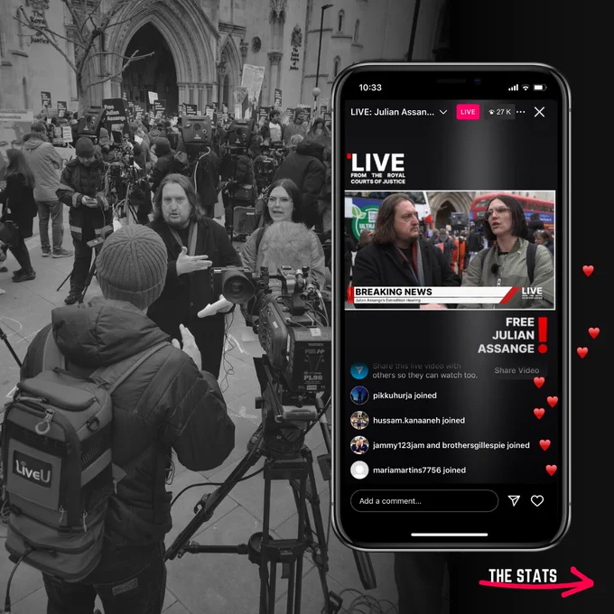 Behind-the-scenes view of a cameraperson with live broadcasting equipment at the Julian Assange extradition trial outside the Royal Courts of Justice, with a crowd of journalists and supporters in the background. A smartphone screen shows a live feed of the event with viewers' comments and reactions.