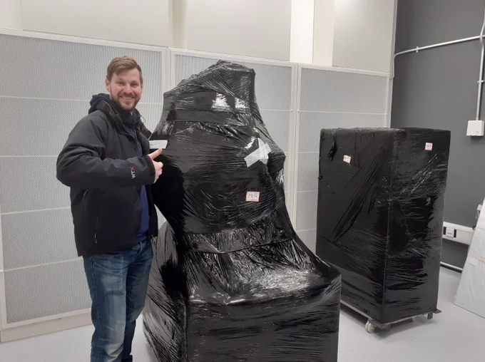 Stuart with part of the Helios, all wrapped up but in its new room