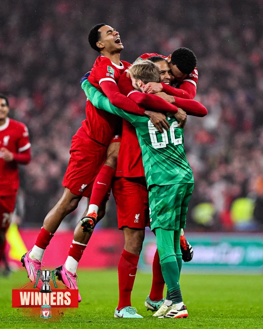 Cody Gakpo, Virgil van Dijk, Joe Gomez and Caoimhin Kelleher celebrate winning the Carabao Cup.