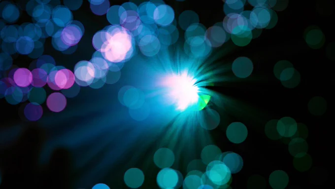 Abstract image of multi-coloured lights against a black background