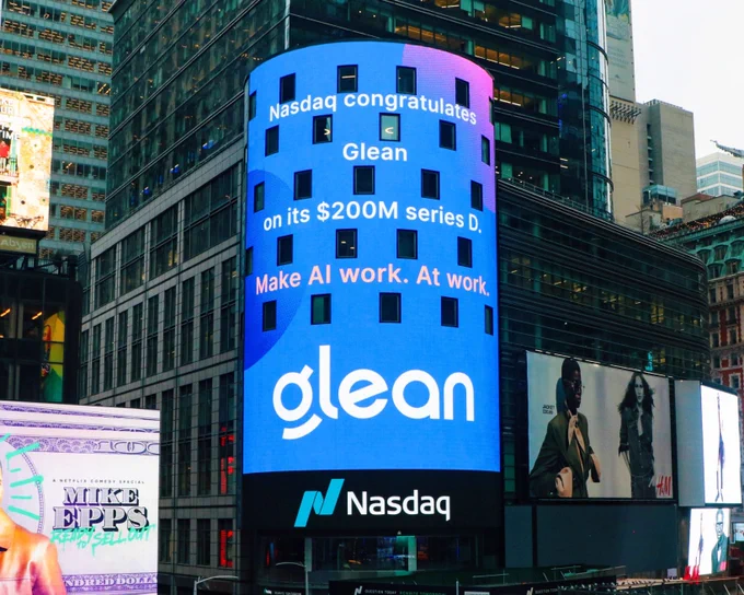 Nasdaq tower with text that reads "Nasdaq congratulates Glean on its $200M series D. Make AI work. At work."