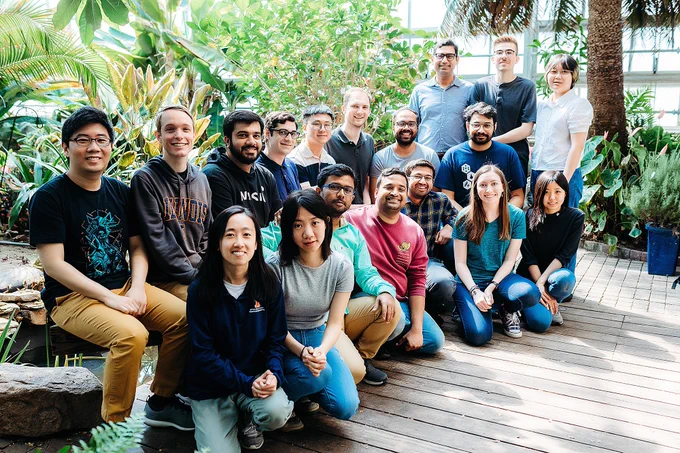 Shukla group members in plant sciences laboratory green house at the University of Illinois in May 2023. Left to right, on ground: Anh Nguyen, Xuenan Mi, Rabindranath Paul, Prateek Bansal, Soumajit Dutta, Sarah Lindley and Nicole Chiang. Left to right, sitting: Yiyang Lu, Tanner Dean, Hassan Nadeem, Diego Kleiman, Song Yin, Austin Weigle, Krishna Narayanan and Arnav Paul. Left to right, standing: Diwakar Shukla, Joseph Clark and Lingyun Xu.