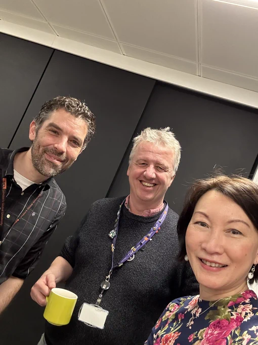 Ben, James and Lilian smiling into the camera.