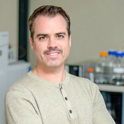 head and shoulders photograph of Michigan State University researcher Robert Quinn, who examines the complex chemistry of the microbiome. 