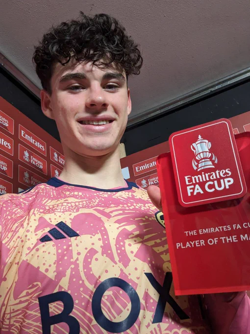 A selfie image of Archie Gray holding the Emirates Player of the Match award