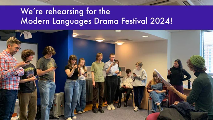 Photo showing several students (some sitting, some standing) in a blue and white room rehearsing lines from a play using their mobile phones. Along the top of the image it states 'We're rehearsing for the Modern Languages Drama Festival 2024!'.