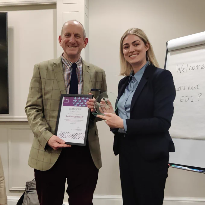 Andrew Rothwell being presented with an award by the Leicestershire CIPD branch chair.