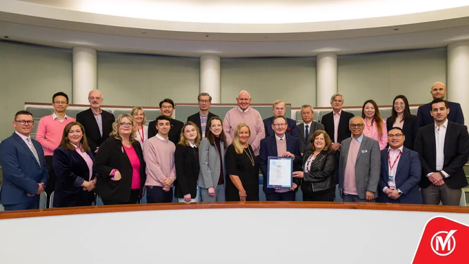 Markham councillors and staff holding a certificate.