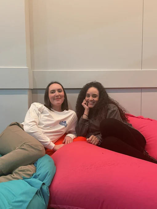 Grace and Sophia smiling on beanbags