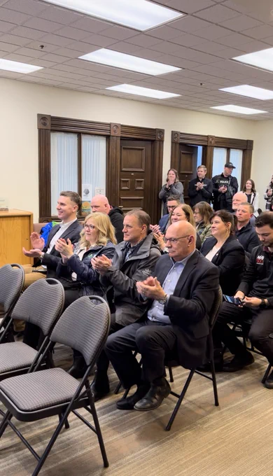 The audience clapping.