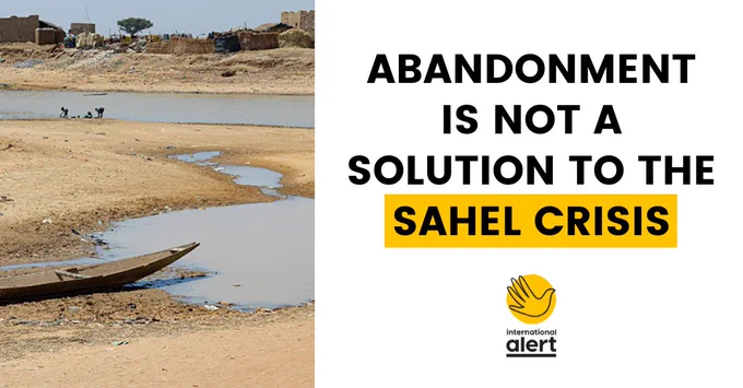 Photo of a pinasse boat stranded in the Inner Niger Delta near Konna, Mali

Text says: Abandonment is not a solution to the Sahel crisis
International Alert logo
