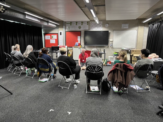 Colleagues taking part in a first aid course