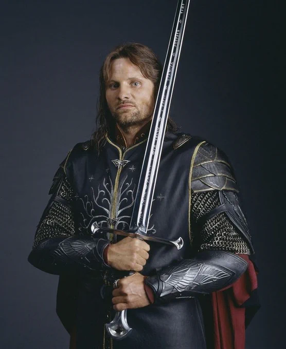 Aragorn in his armor from the end of The Return of the King, holding Andúril, Flame of the West