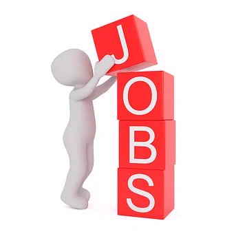 A cartoon figure stacking blocks. The blocks are red with white letters on. When stacked the blocks spell the word 'jobs'.