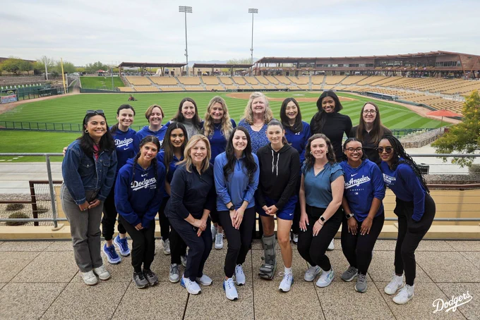 A photo of the women that make up the Dodger front office posing at Camelback Ranch.