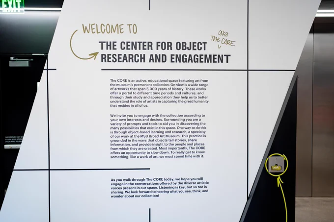 A white entrance sign with black writing that says Welcome to the Center for Object Research and Engagement with the CORE's mission underneath