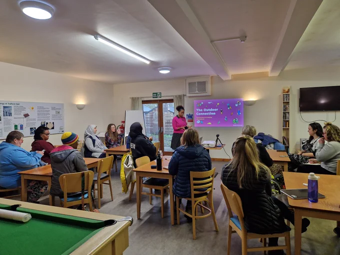 Kike Agunbiade holding a seminar on managing stress and wellbeing at The Outdoor Connection at YHA Chester Trafford Hall.