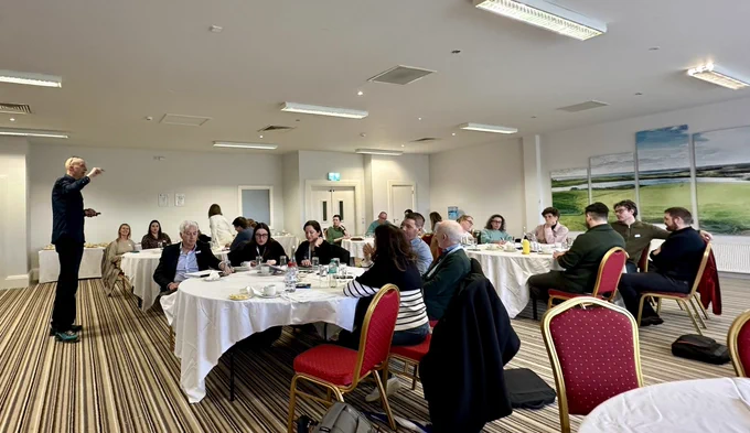 Workshop participants at round tables