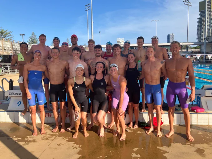 A poolside picture of the Bath Performance Group swimmers on training camp on the Gold Coast, alongside some of the Swimming Australia athletes