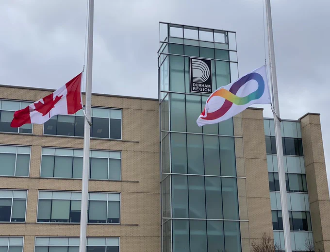 The Neurodiversity pride flag flying on a community flagpole at Regional Headquarters.