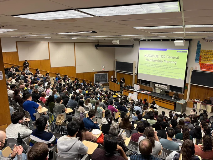 NUGW General membership meeting in a packed lecture hall
