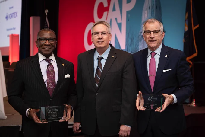 Rep. O'Neal holds his award with his co-legislator of the year and an MML representative.