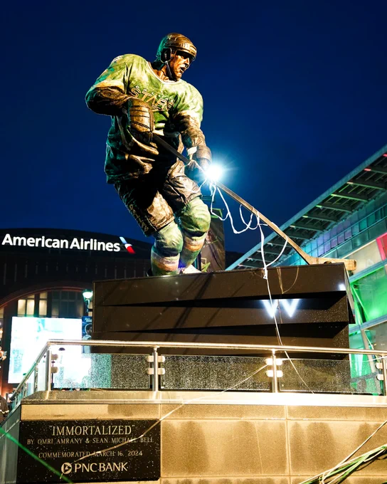 Immortalized statue of mike modano featuring the 1999 dallas stars jersey, mike handling a puck, and the iconic jersey flap in the back (not pictured)