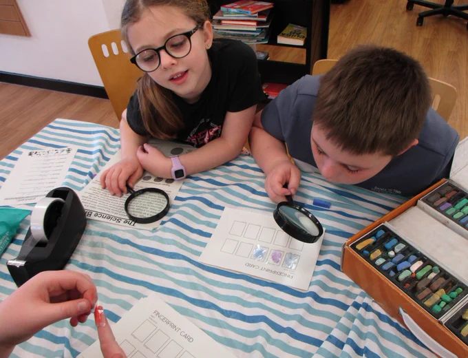 children with magnifying glasses