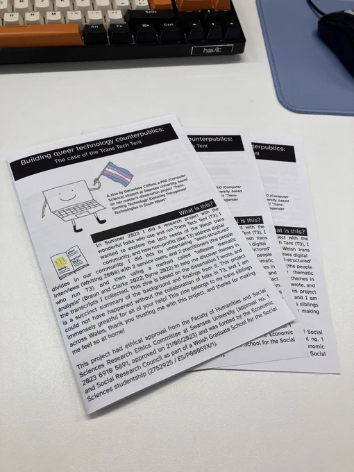 Three copies of my zine stacked on top of each other, the front page is visible and has the title "Building queer technology counterpublics: the case of the Trans Tech Tent" and contains information about the project I had undertaken.