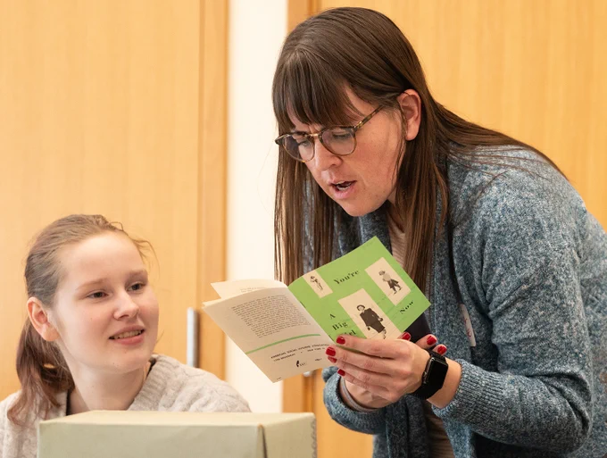 A student studies archival materials from the Tretter Collection.