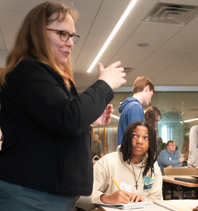 Anne Good, Assistant Curator of the James Ford Bell Library, talks to students about archival materials.