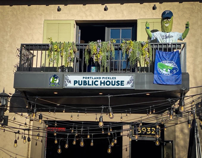 Dillon T. Pickle on the balcony of the NEW Pickles Pub location