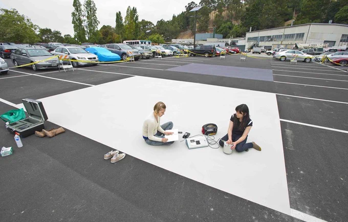 Researchers measure the reflectivity of cool pavement coatings at Berkeley Lab.
