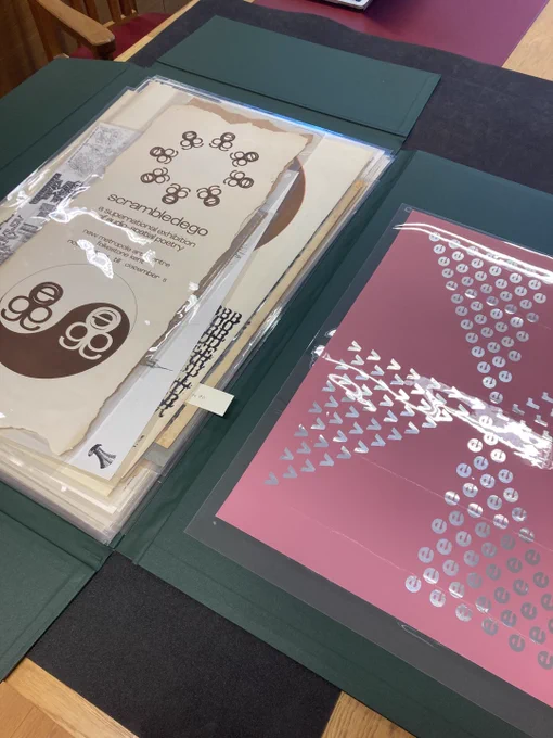 Image of Hyunjung An's cataloguing work in progress. Paper items in Melinex are arranged on a foam-covered table.