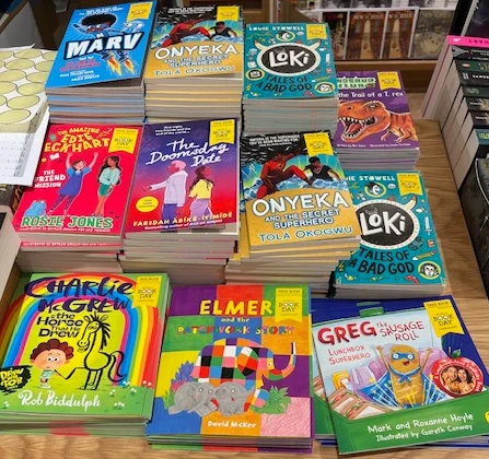 Piles of books on display for World Book Day