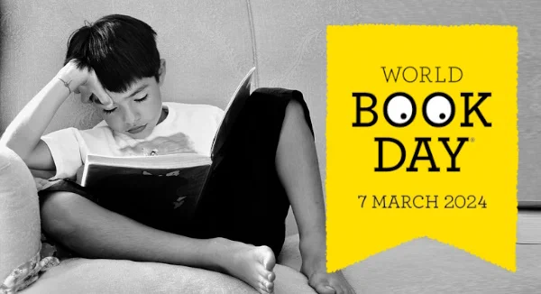 Boy on a sofa reading by Sofía López Olald with World Book Day logo