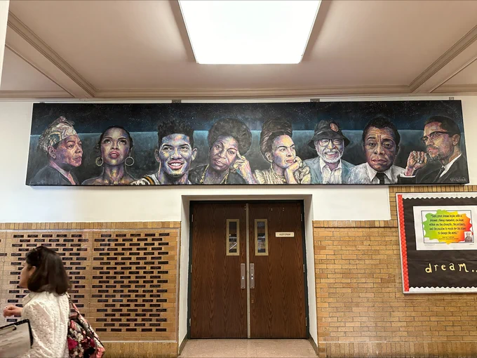 school hallway featuring a large mural above double doors