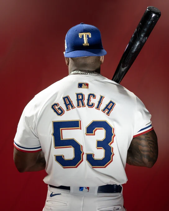 Adolis García wearing the Rangers World Series Champion gold uniform 
