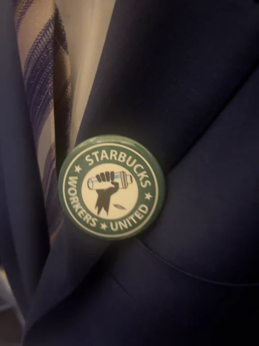 Close up of the Starbucks Workers United pin
