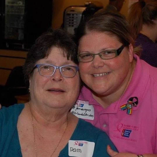 Image of a mother and daughter smiling, wearing Making Strides Against Breast Cancer Orlando name tags.