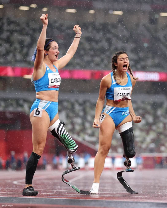 Gold medalist, Ambra Sabatini of Team Italy (R) and silver medalist Martina Caironi (L) of Team Italy celebrate after competing in the Women's 100m - T63 Final